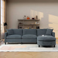 Canapé d'angle 4 places en tissu gris foncé avec pouf et accoudoir de rangement