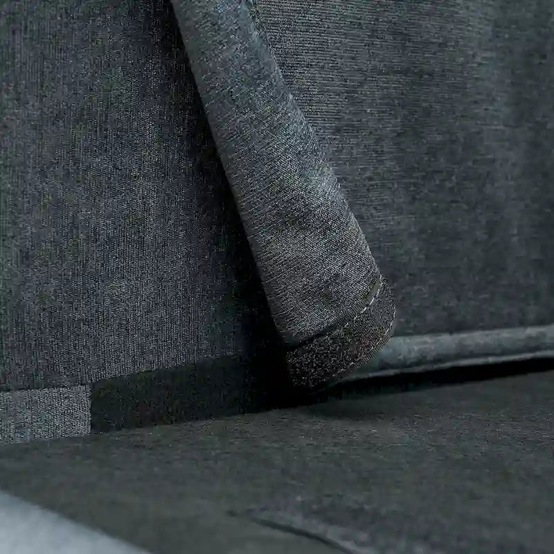 Canapé d'angle 4 places en tissu gris foncé avec pouf et accoudoir de rangement