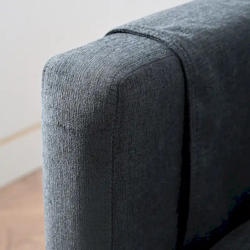 Canapé d'angle 4 places en tissu gris foncé avec pouf et accoudoir de rangement